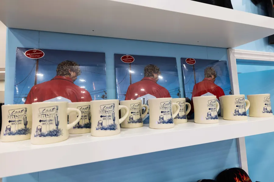 Lost Diner mugs lined up on the booth shelf