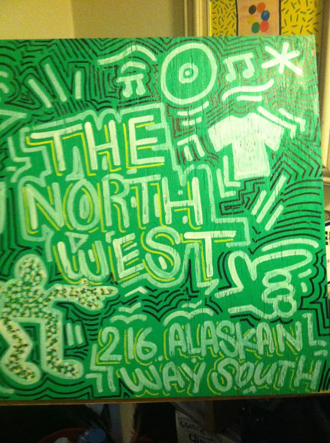Hand-painted sign for The North West clothing store, 216 Alaskan Way South, Seattle