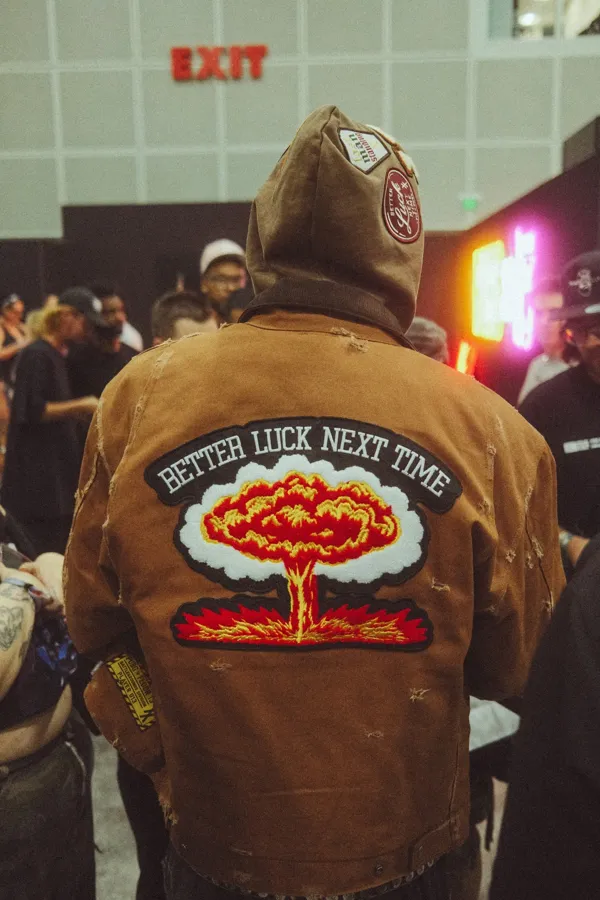 PUBG x Floor 13 work jacket with the Better Luck Next Time mushroom-cloud patch at ComplexCon. Photo by Sam Cahill